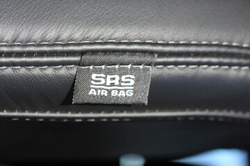 SRS Air Bag label on leather car seat