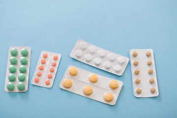 pills in blisters  on blue background