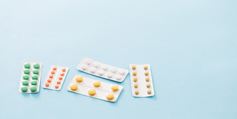 pills in blisters  on blue background