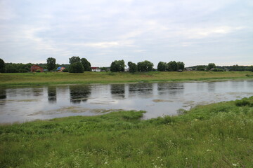 Cloudy day with clouds on the river in the countryside