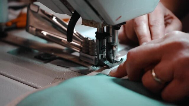 Slow close up of sewing machine working