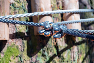 Steel cable fastening mechanism, part of the cable route. Extreme sport.