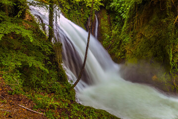 A long exposure close up view of a major waterfall at Marmore, Umbria, Italy in summer