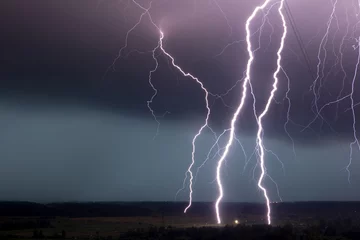 Fotobehang strong storm with amazing and dangerous lightning at night © Kotov