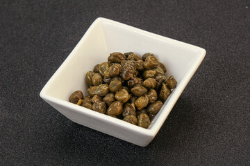 Tasty capers in the bowl