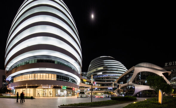BEIJING, CHINA-MAY 5, 2017: Panorama of Galaxy SOHO at night. Galaxy SOHO is a large development of office and retail space designed by Zaha Hadid Architects and completed in 2012.  