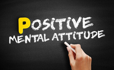 Positive Mental Attitude text on blackboard, concept background