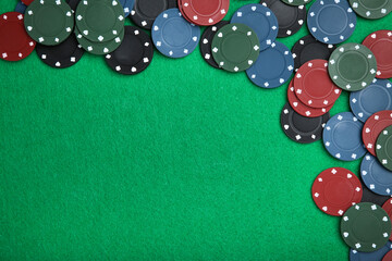 Poker chips on green table
