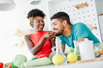 african american black couple kitchen home cooking love happy together indoor food
