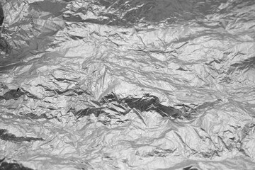 Textured crumpled crumpled abstract unusual gray silver background.