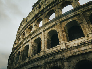 Naklejka premium Coliseum in Rome on a cloudy day