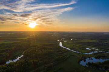 Beautiful orange sunset over the Teza river in the Ivanovo region.