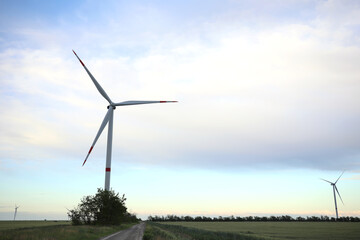 Beautiful view of landscape with wind turbine. Alternative energy source