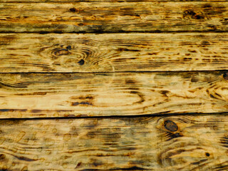 
Wood texture: burned pine boards with water drops