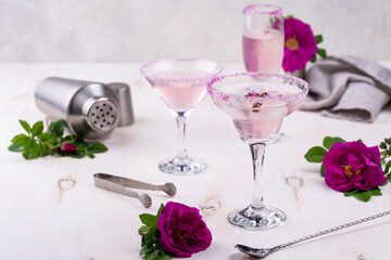 Assortment of pink cocktails with rose syrup.