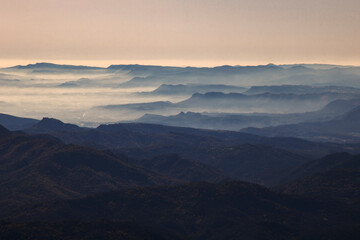 Fototapeta na wymiar layers of mountains among the mist