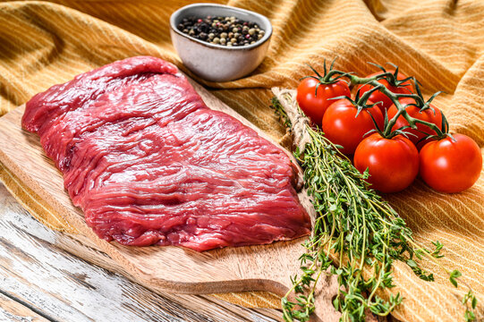 Fresh Outside Skirt Steak On A Chopping Board. White Background. Top View