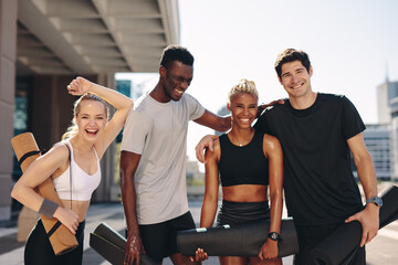 Healthy fitness group standing outdoors