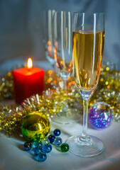 glass of champagne and christmas decorations