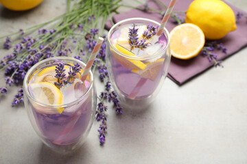 Fresh delicious lemonade with lavender on grey table
