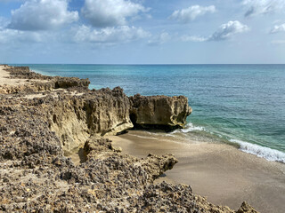 A rocky beach with clear turquoise water in Stuart, FL