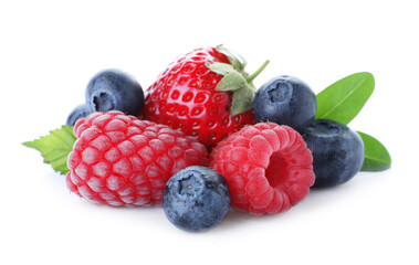 Pile of different ripe tasty berries with green leaves isolated on white
