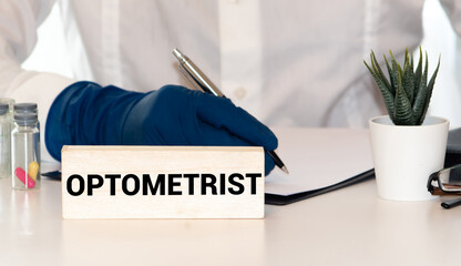 21st of April 2016 - Scene from Belarusian city with close up of sign with the cyrillic text: Optika Vratch