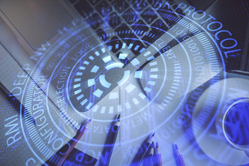 Double exposure of data drawing hologram over topview of study desk background with computer. Concept of Ai.