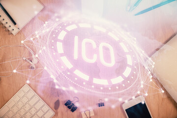 Double exposure of blockchain theme hologram over table with phone. Top view. Crypto technology concept.