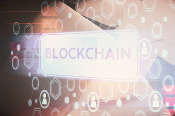 Double exposure of blockchain theme hologram over table with phone. Top view. Crypto technology concept.