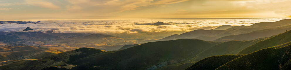 Fototapeta na wymiar Layers of Clouds, View of Mountains, Valleys, Peaks