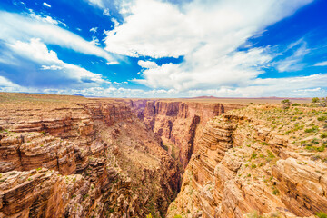 Panoramic image of the colorful Sunset on the Grand Canyon in Grand Canyon National Park from the south rim part,Arizona,USA, on a sunny cloudy day with blue or gloden sky