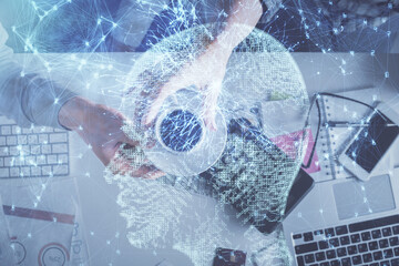 Double exposure of man and woman working together and human brain hologram drawing. Brainstorm concept. Computer background. Top View.