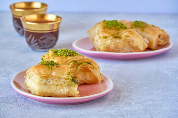 Sweets arabic dessert knafeh with pistachio and cheese