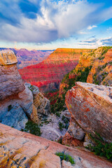 Panoramic image of the colorful Sunset on the Grand Canyon in Grand Canyon National Park from the south rim part,Arizona,USA, on a sunny cloudy day with blue or gloden sky
