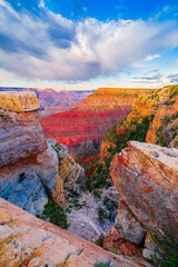Panoramic image of the colorful Sunset on the Grand Canyon in Grand Canyon National Park from the south rim part,Arizona,USA, on a sunny cloudy day with blue or gloden sky