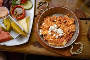 Directly above shot of meal served on wooden table at sidewalk cafe