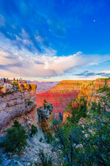 Panoramic image of the colorful Sunset on the Grand Canyon in Grand Canyon National Park from the south rim part,Arizona,USA, on a sunny cloudy day with blue or gloden sky