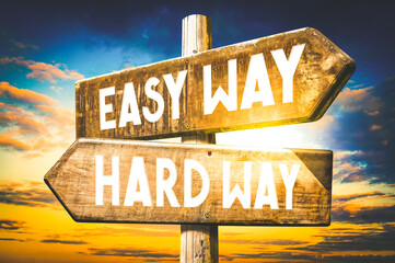 Easy way, hard way - wooden signpost, roadsign with two arrows