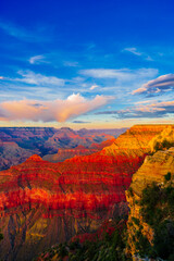 Panoramic image of the colorful Sunset on the Grand Canyon in Grand Canyon National Park from the south rim part,Arizona,USA, on a sunny cloudy day with blue or gloden sky