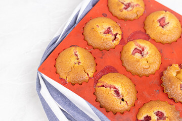 Cup cakes with cherries in the silicone mold