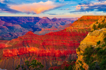 Panoramic image of the colorful Sunset on the Grand Canyon in Grand Canyon National Park from the south rim part,Arizona,USA, on a sunny cloudy day with blue or gloden sky