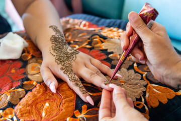 Beautiful Sikh model having henna designed and placed upon her body