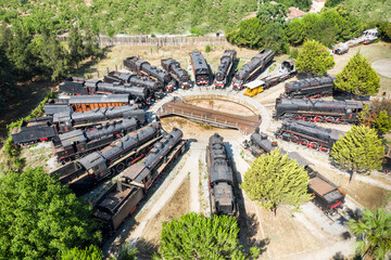 Antique steam locomotive, German made Old vintage  locomotives  lined up in circle. Aerial view drone shooting. Efes, Selcuk TURKEY