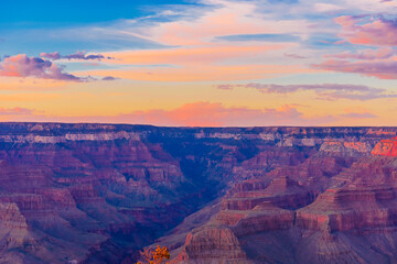 Panoramic image of the colorful Sunset on the Grand Canyon in Grand Canyon National Park from the south rim part,Arizona,USA, on a sunny cloudy day with blue or gloden sky