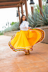 Beautiful female Mexican folk dancer