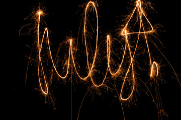 Photos of drawings with sparklers on July 4th