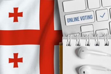 Online voting concept in Georgia. Keyboard near country flag.
