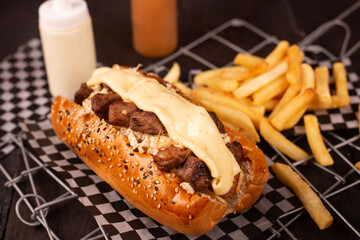 hot dog with meat and french fries