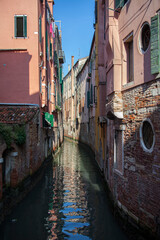 In Venice, Italy, apartments and houses are separated by narrow canals.
